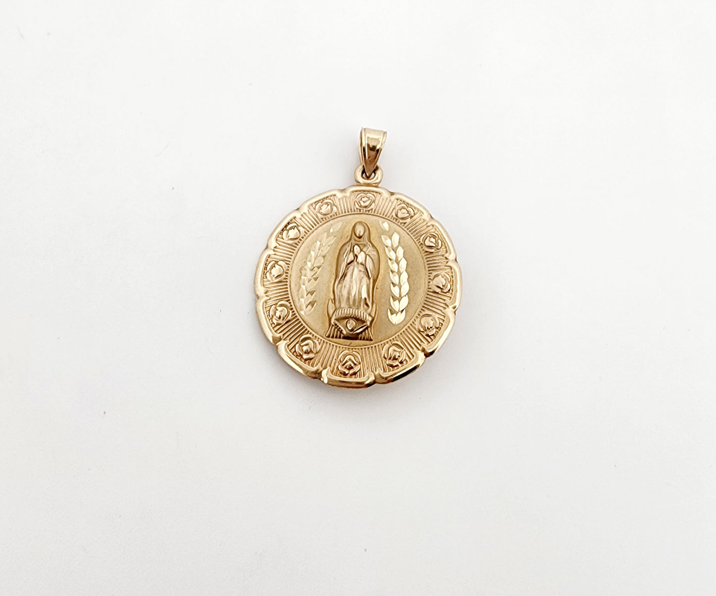 Medalla de Ntra Señora de Guadalupe y el rostro de Cristo